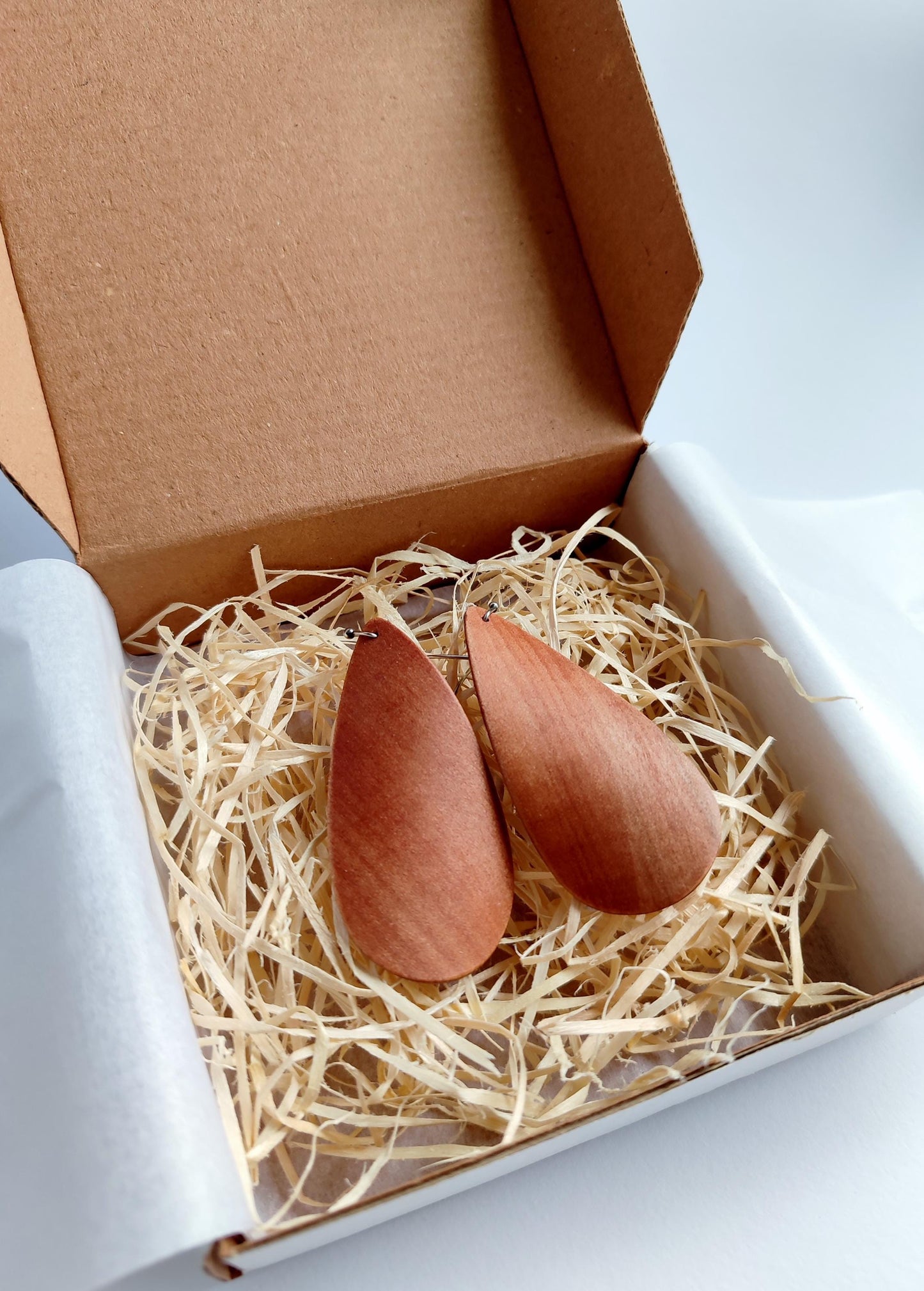 Wooden teardrop dangle earrings in a gift box